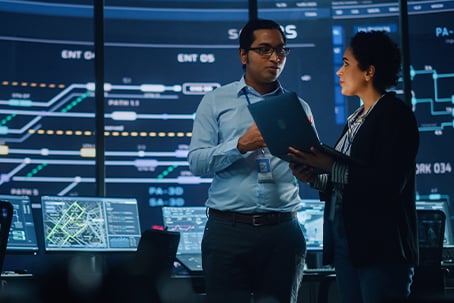 Project Manager and IT Technical Engineer with Laptop